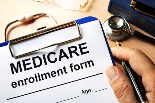medicare enrollment form on clipboard